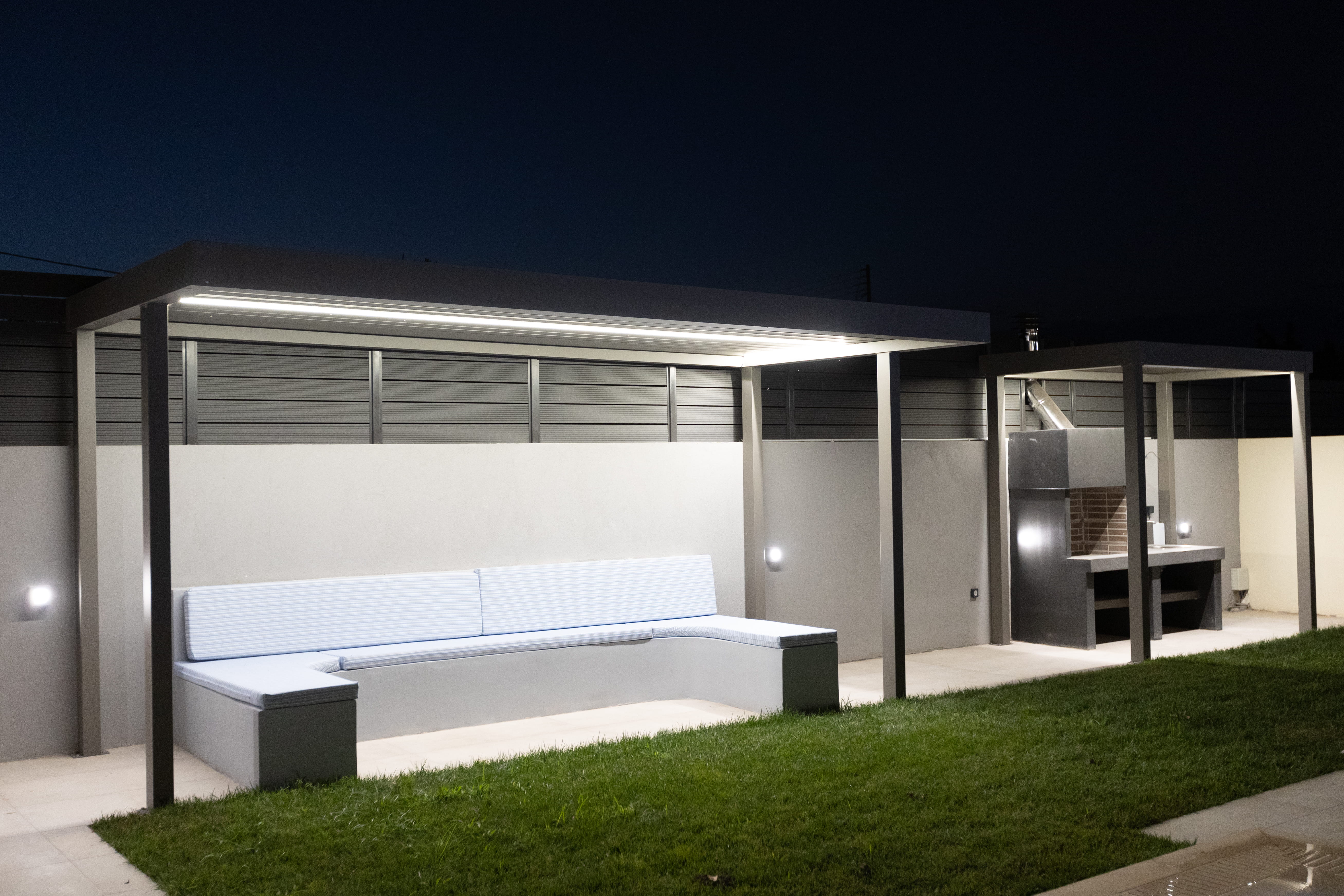 Kidney-shaped private pool glowing blue at night at 3 bedroom Infinity Lefkas villa