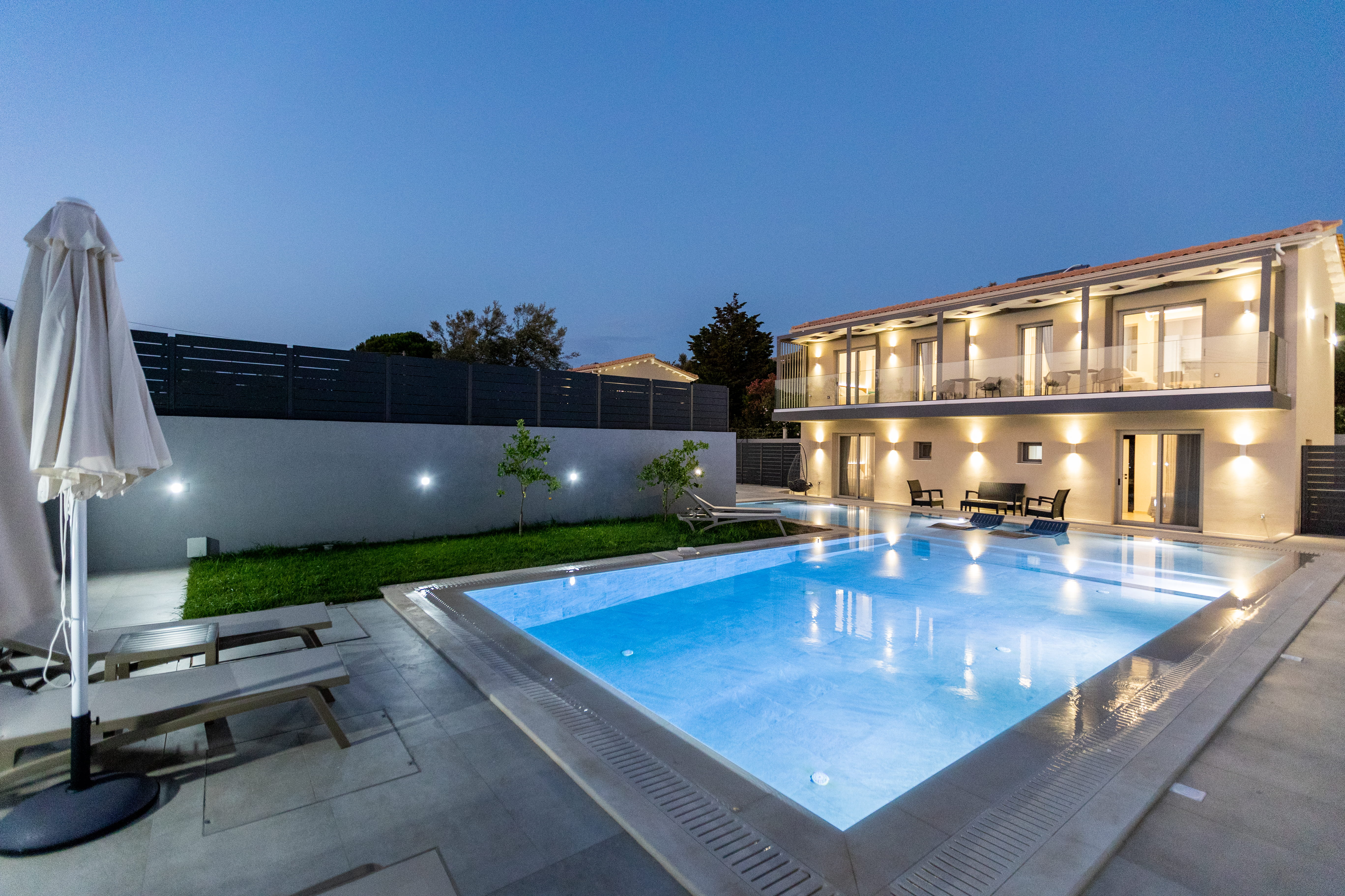 Infinity Lefkas luxury villas at night with illuminated pool — Lefkada Greece