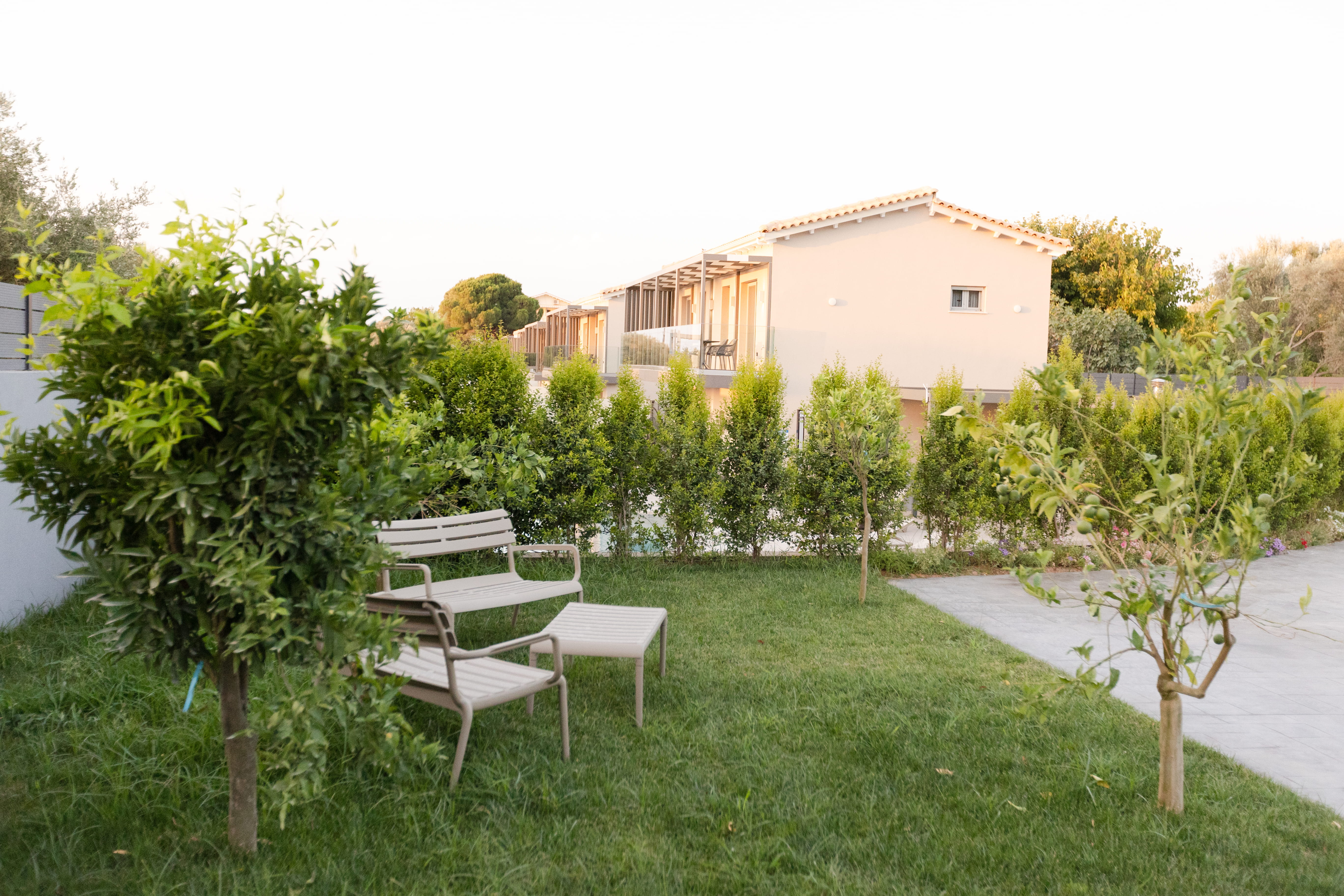 Infinity Lefkas villa garden at golden hour — Lefkada island Greece