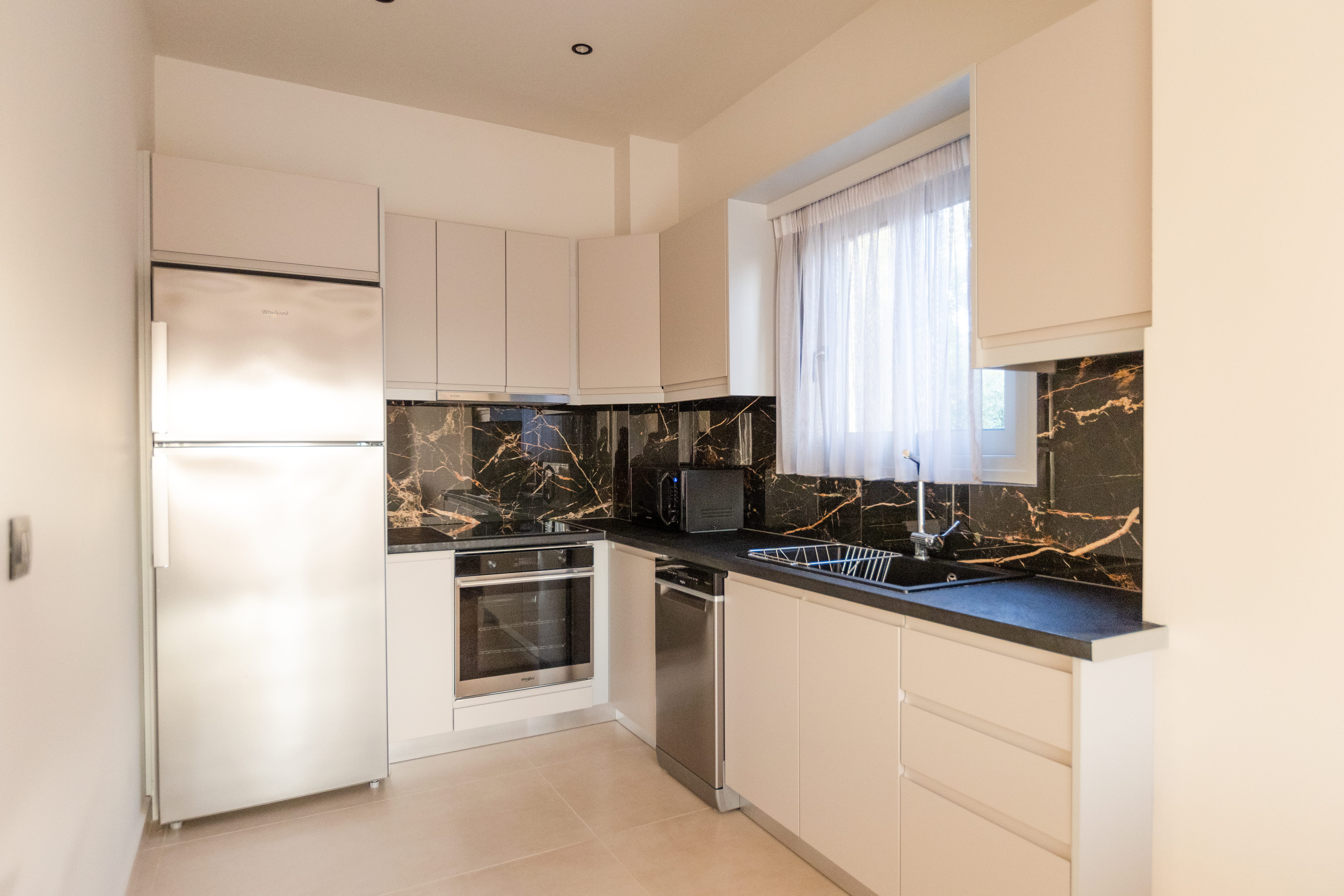 Fully equipped kitchen with black marble splashback at 3 bedroom villa Lefkada