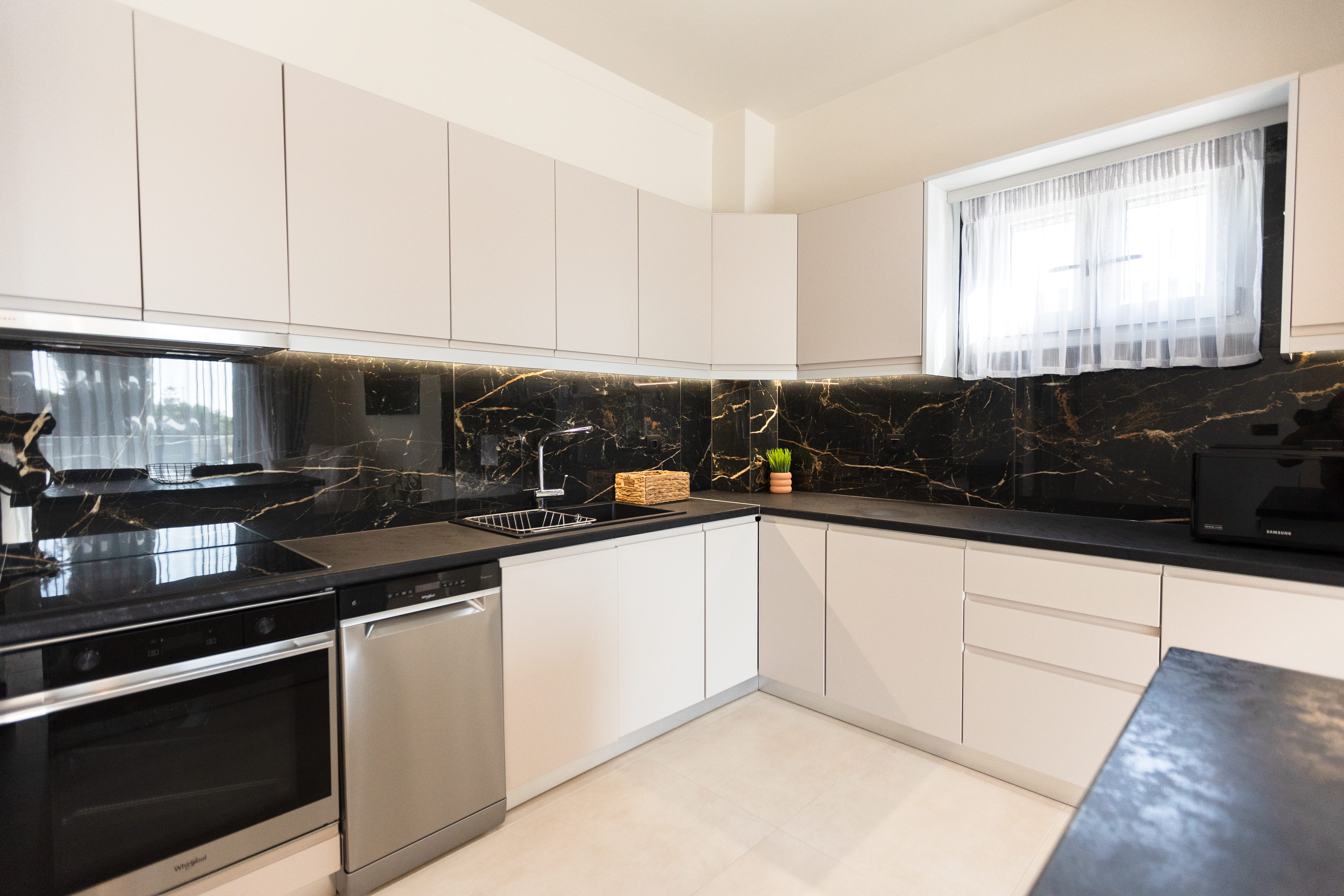 Fully equipped kitchen with black marble splashback at 4 bedroom Infinity Lefkas villa