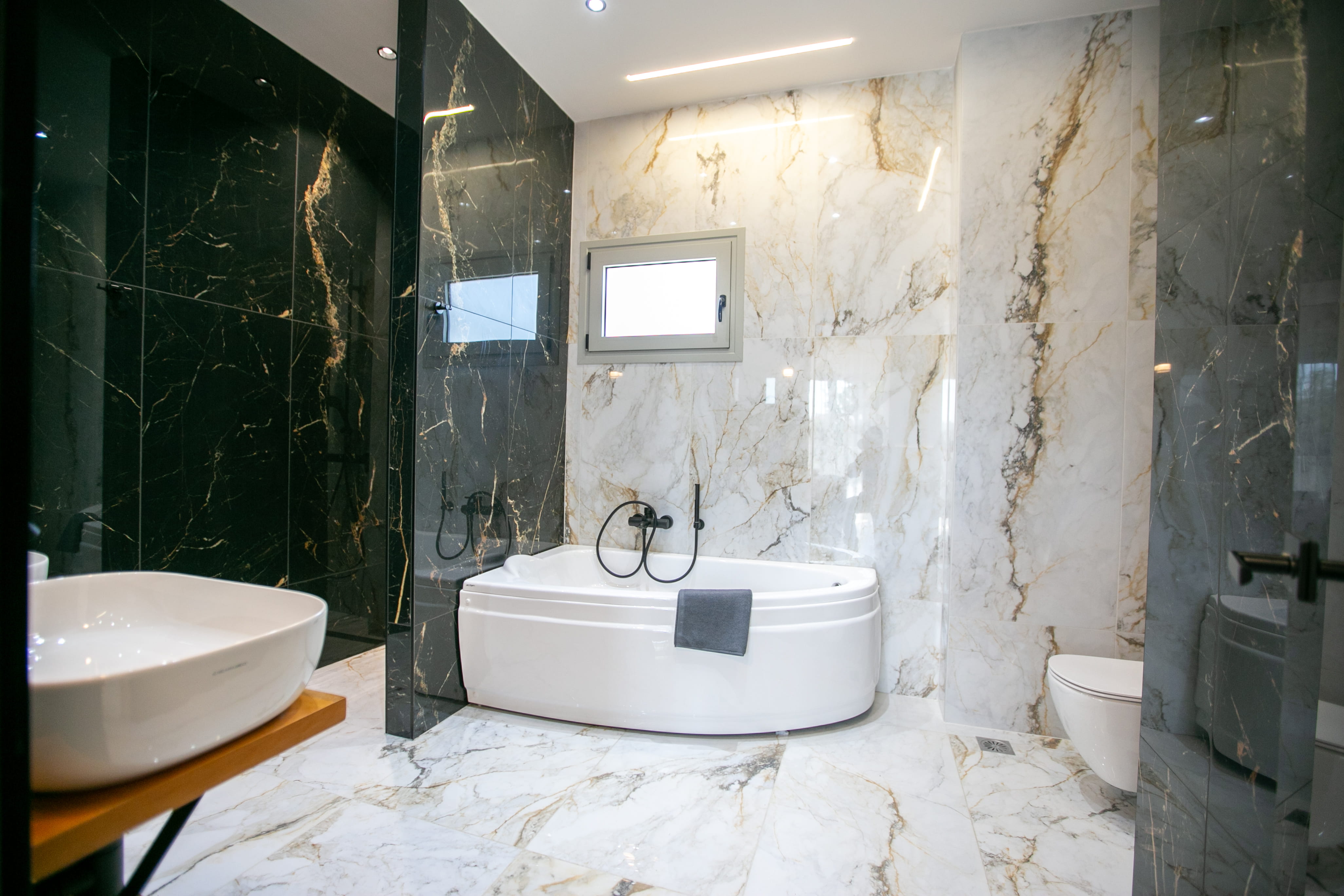 Luxury marble en-suite bathroom with freestanding bath at Infinity Lefkas villa Lefkada