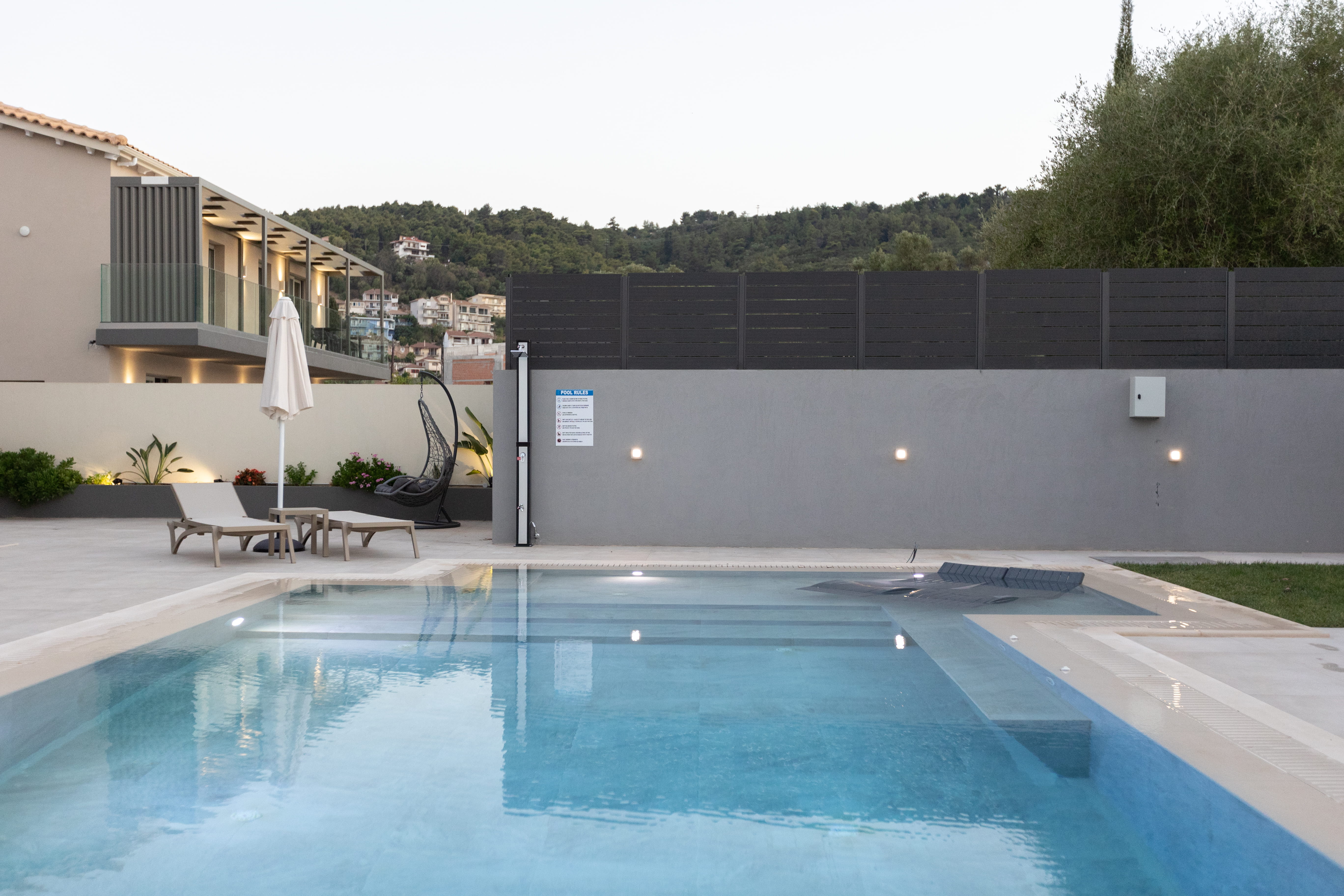 Infinity Lefkas villa with Lefkada hillside and town visible in the background — location shot